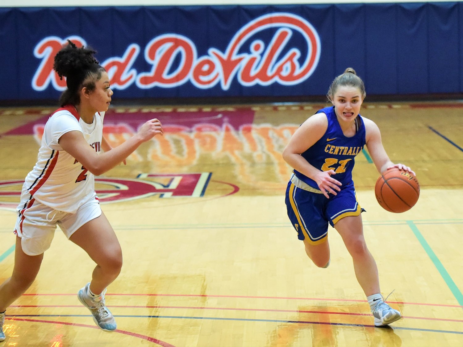 Centralia College point guard Allison DeBerry, right, drives into the lane against Lower Columbia College on Feb. 2.